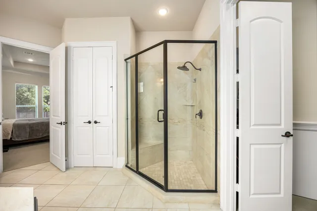 a bathroom with a shower and a sink