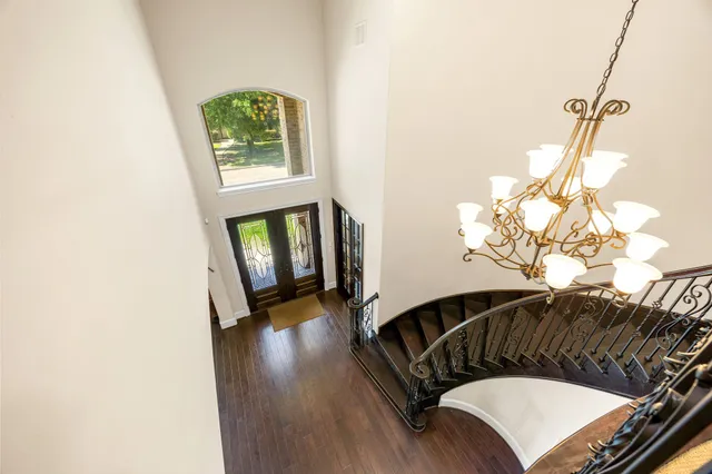 a view of a balcony with wooden floor and staircase