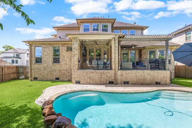 a view of a house with a tub and a garden