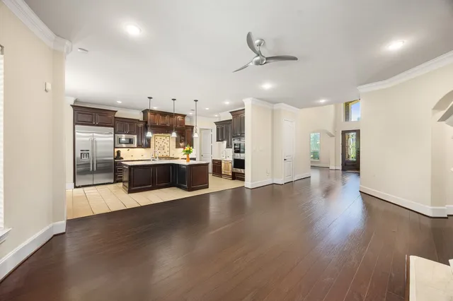 a view of a kitchen and kitchen with a wooden floor