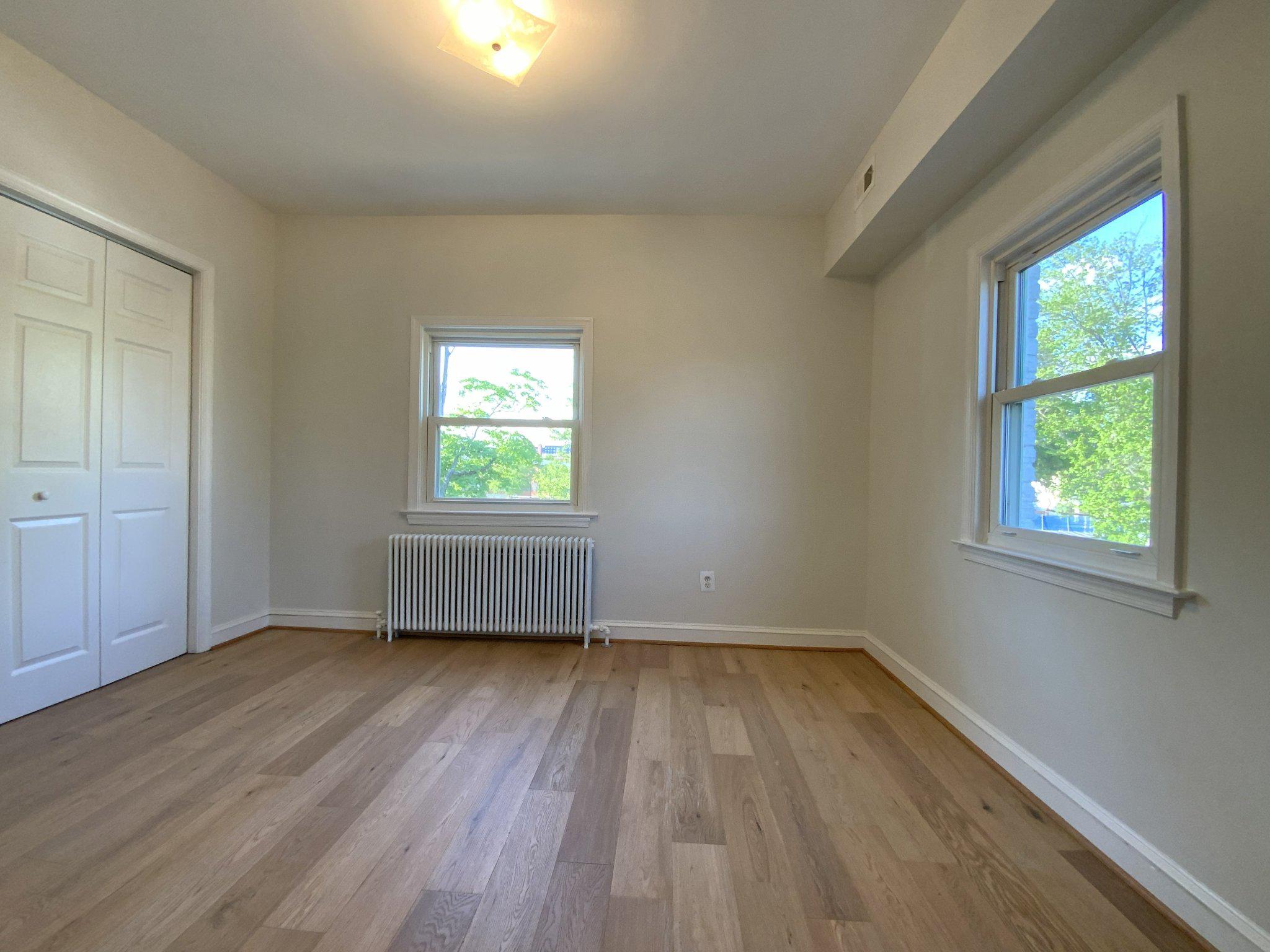 1772 E Street Northeast Washington, DC 20002 - Photo 14 of 23 wooden floor in an empty room with a window