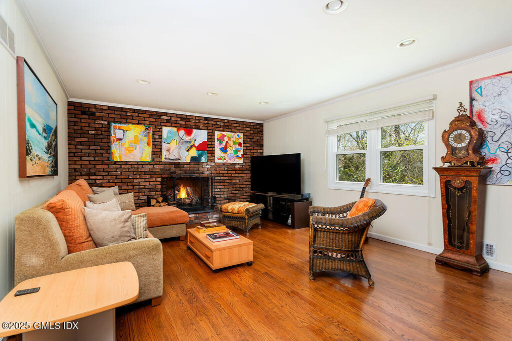 19 Stanwich Road Greenwich, CT 06830 - Photo 12 of 32 a living room with furniture a flat screen tv and a fireplace