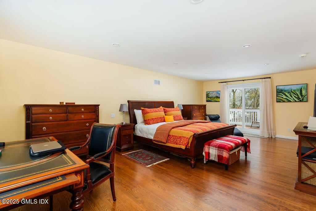 19 Stanwich Road Greenwich, CT 06830 - Photo 17 of 32 a bedroom with a bed and wooden floor