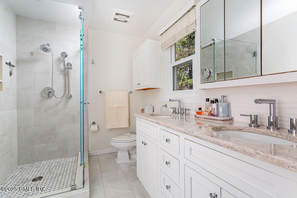 19 Stanwich Road Greenwich, CT 06830 - Photo 18 of 32 a bathroom with a granite countertop sink mirror and toilet