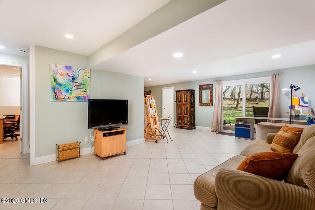 19 Stanwich Road Greenwich, CT 06830 - Photo 20 of 32 a living room with furniture and a flat screen tv