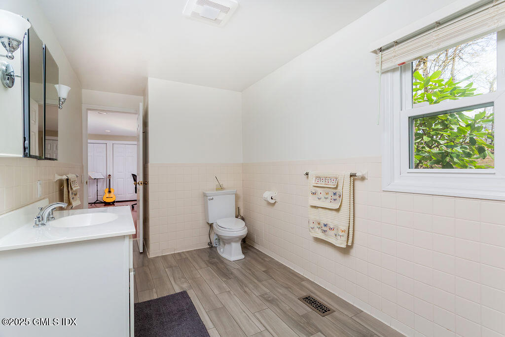19 Stanwich Road Greenwich, CT 06830 - Photo 24 of 32 a bathroom with a sink toilet and window