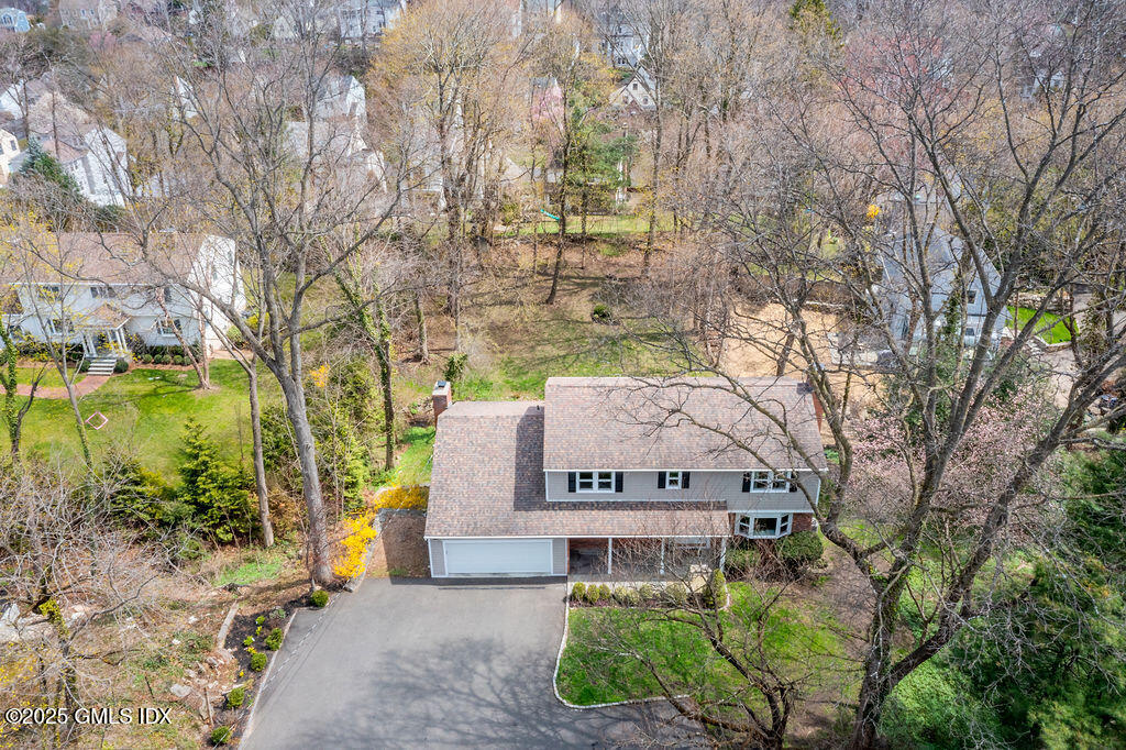 19 Stanwich Road Greenwich, CT 06830 - Photo 29 of 32 a front view of a house with a garden