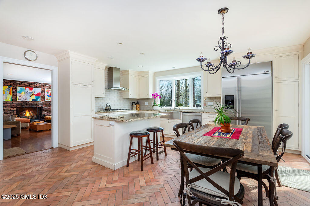 19 Stanwich Road Greenwich, CT 06830 - Photo 9 of 32 a view of dining table and chairs in a room