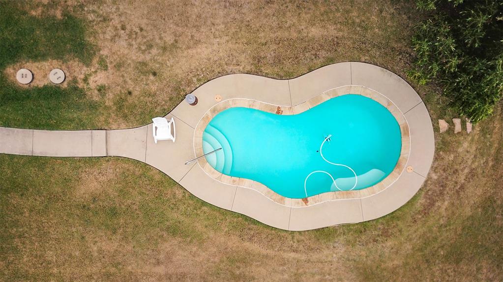 230 South Walnut Grove Road Midlothian, TX 76065 - Photo 5 of 5 View of pool with a lawn