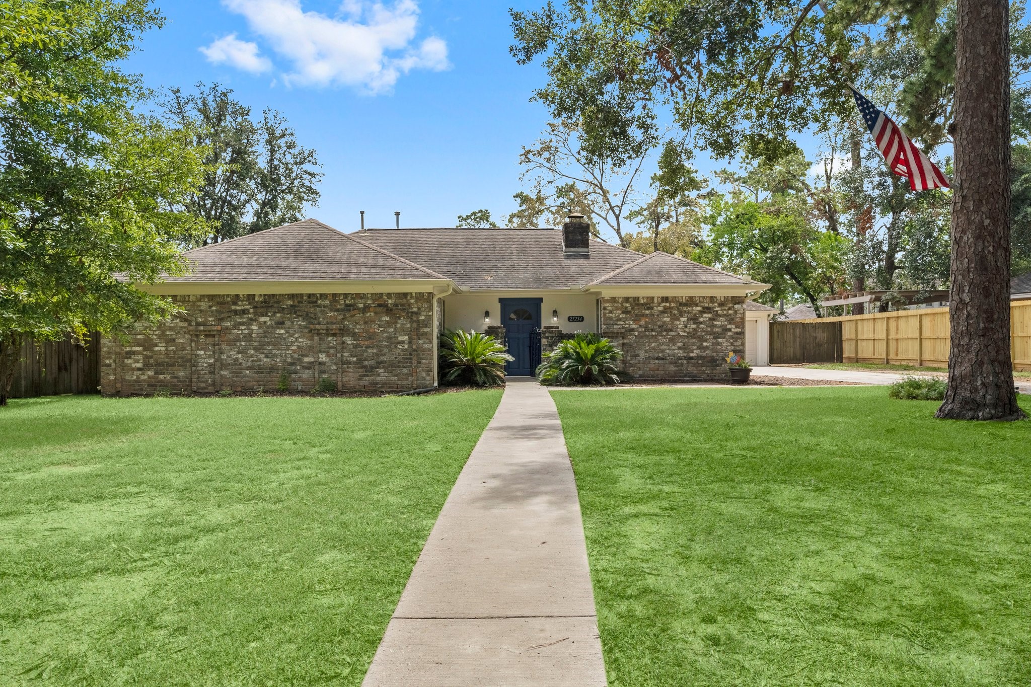 27234 Wells Lane Conroe, TX 77385 - Photo 15 of 15 front view of a house with a yard