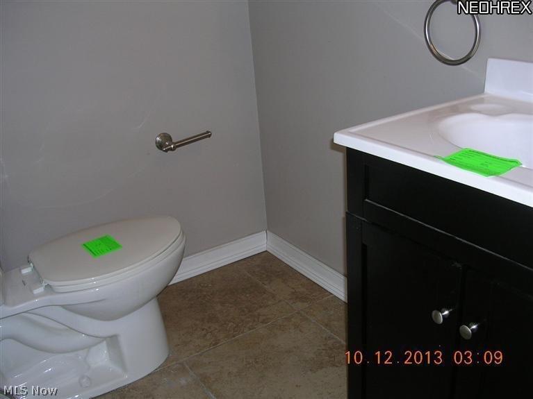 9201 Reichert Road Parma, OH 44130 - Photo 4 of 11 half bath has been freshly painted, is updated and has ceramic tile floors