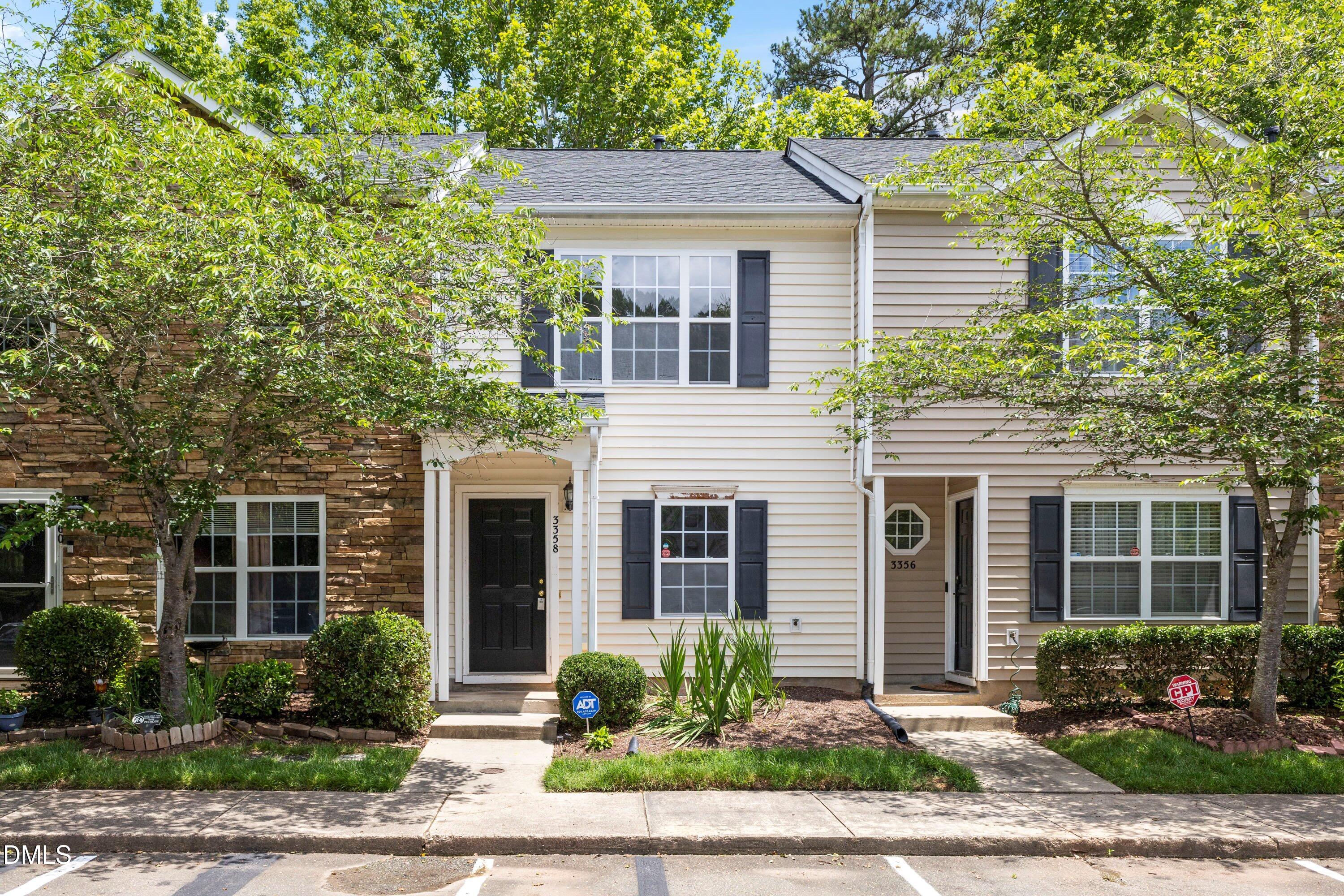 3358 Tarleton West Durham, NC 27713 - Photo 2 of 23 a front view of a house with garden