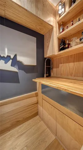 a kitchen with counter top space a sink and a window