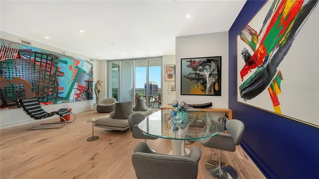 a view of a workspace with furniture and a kitchen