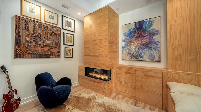 a view of entryway livingroom and hall with wooden floor