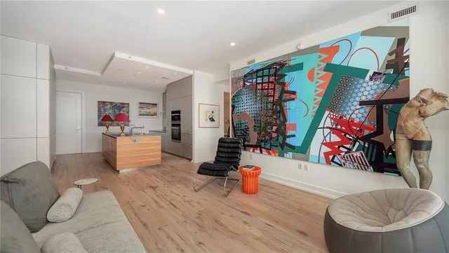 a lobby with furniture and floor to ceiling window