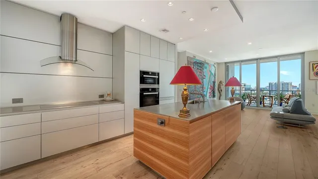 a kitchen with sink refrigerator and cabinets