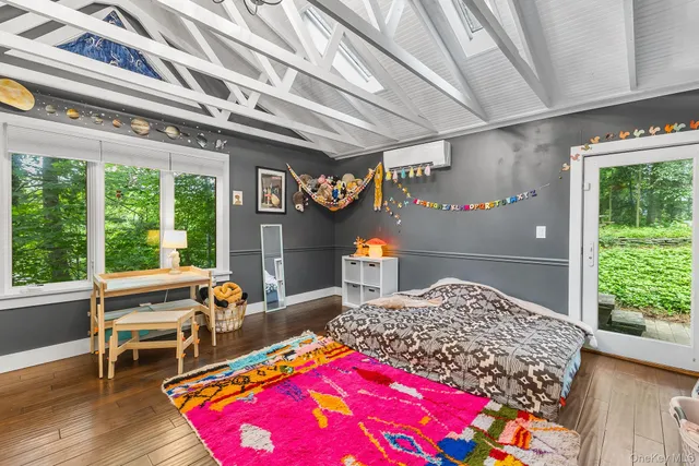 a bedroom with furniture and a chandelier