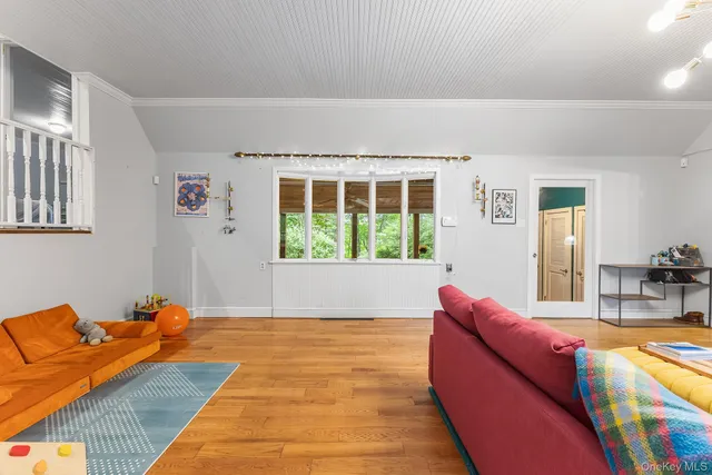 a kitchen with stainless steel appliances granite countertop a sink a stove a refrigerator cabinets and chairs