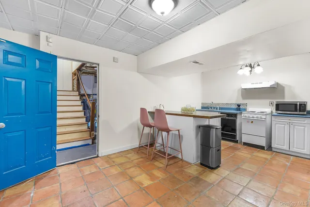 a kitchen with a stove and a microwave