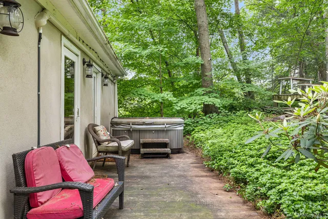 a backyard of a house with outdoor seating