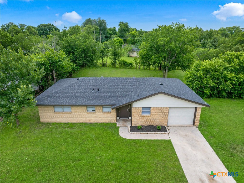 1609 Linwood Road Temple, TX 76502 - Photo 1 of 25 a aerial view of a house with a yard plants and large tree