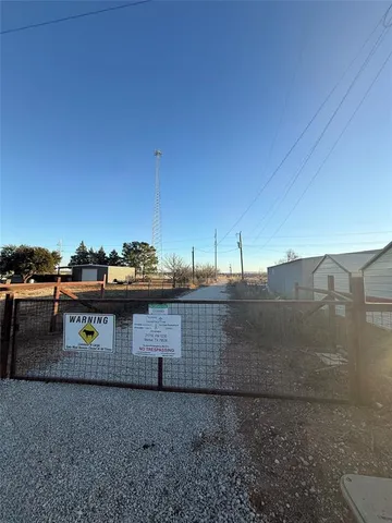 a view of a balcony with two chairs