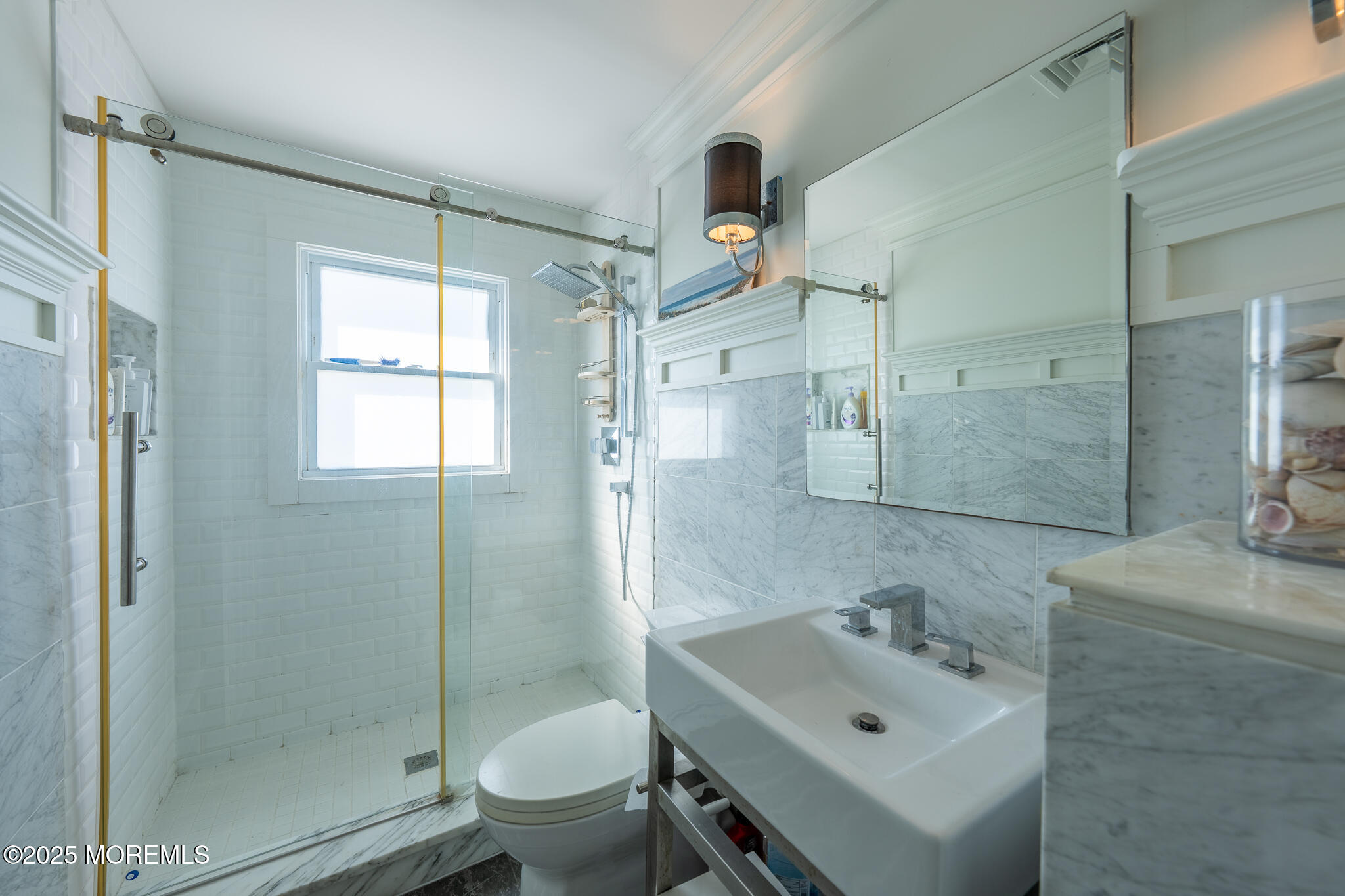 14 Falls Road Mantoloking, NJ 08738 - Photo 17 of 40 a bathroom with a sink mirror toilet and shower