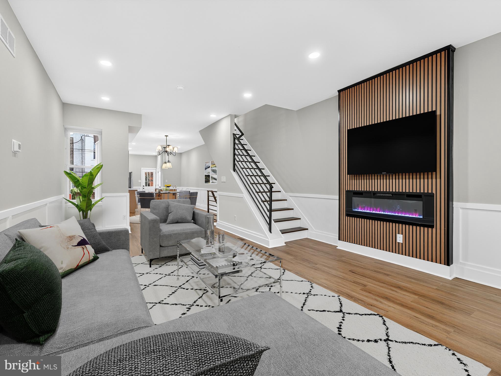 5736 Spruce Street Philadelphia, PA 19139 - Photo 1 of 32 a living room with furniture and a flat screen tv