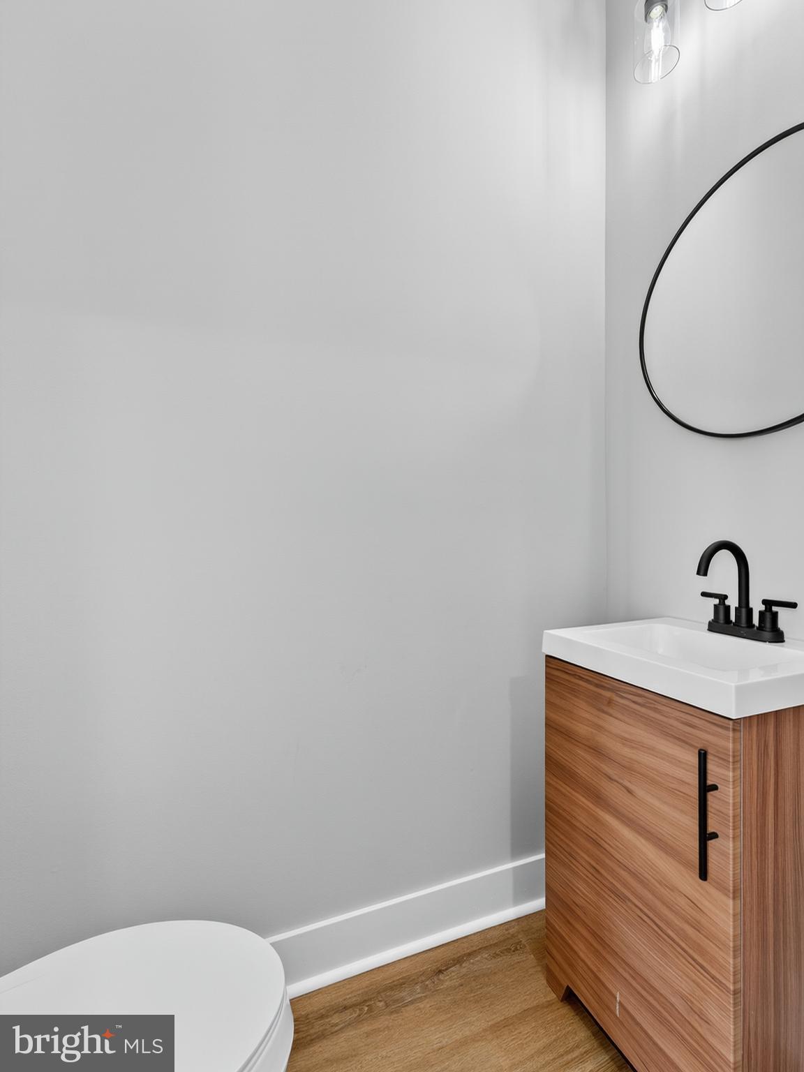 5736 Spruce Street Philadelphia, PA 19139 - Photo 12 of 32 a bathroom with a sink and a mirror