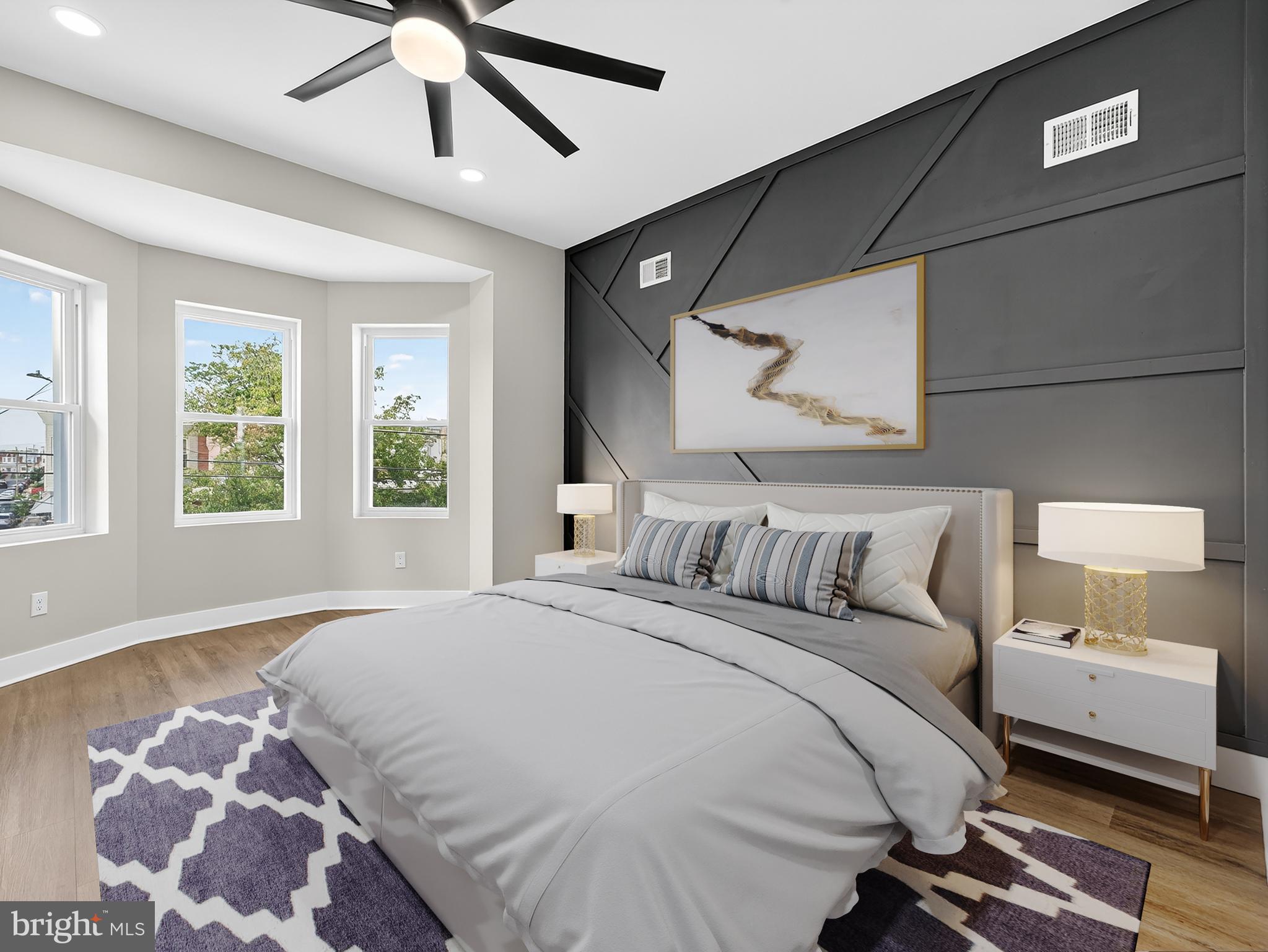 5736 Spruce Street Philadelphia, PA 19139 - Photo 13 of 32 a bedroom with a large bed and a window