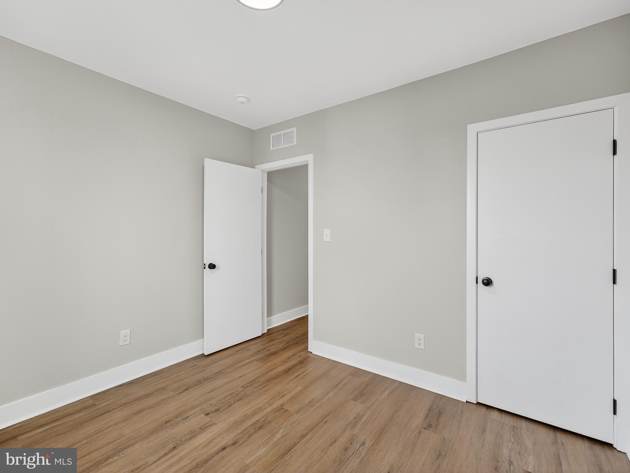 5736 Spruce Street Philadelphia, PA 19139 - Photo 24 of 32 a view of an empty room with wooden floor