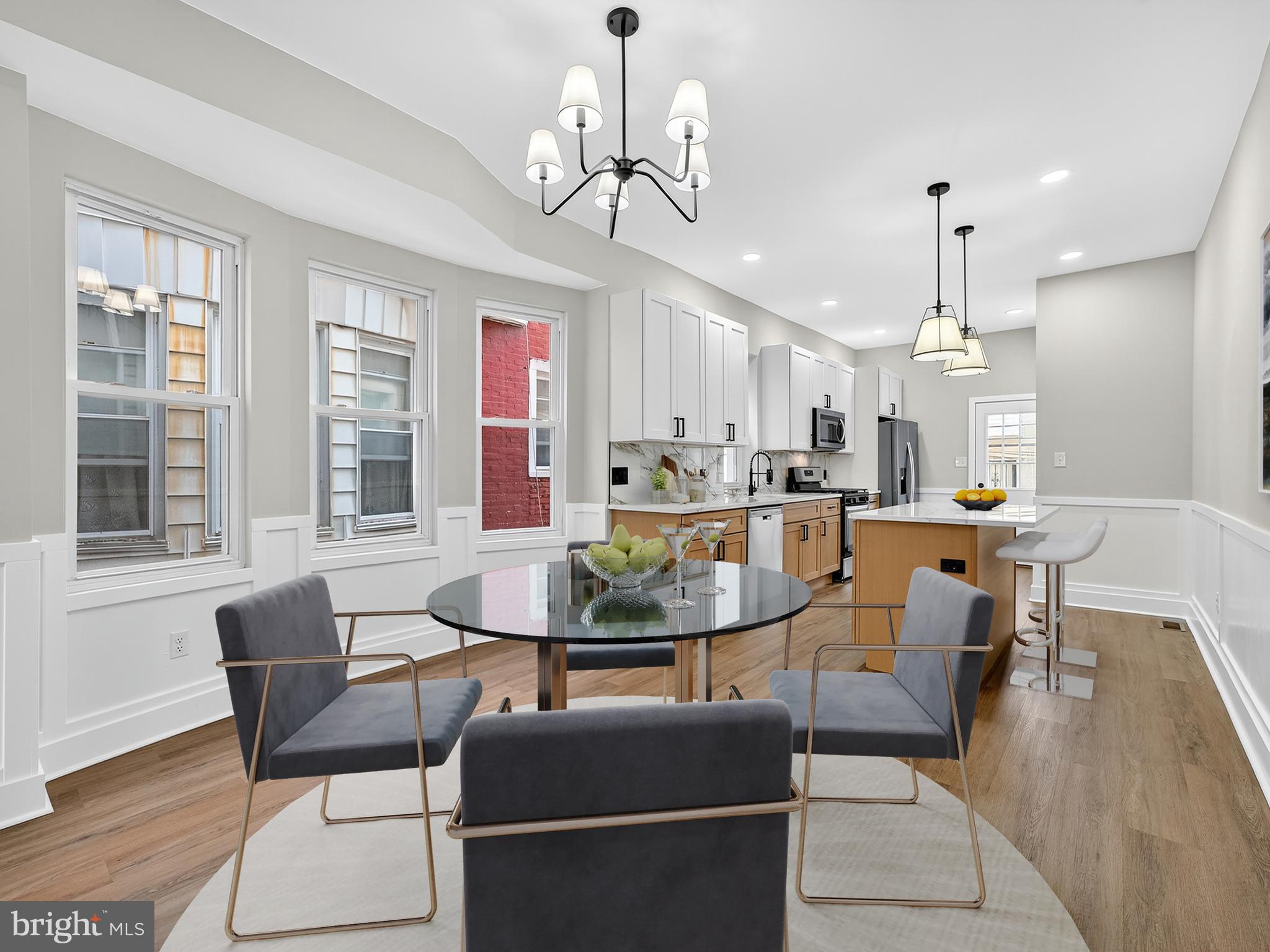 5736 Spruce Street Philadelphia, PA 19139 - Photo 3 of 32 a view of a dining room with furniture window and wooden floor