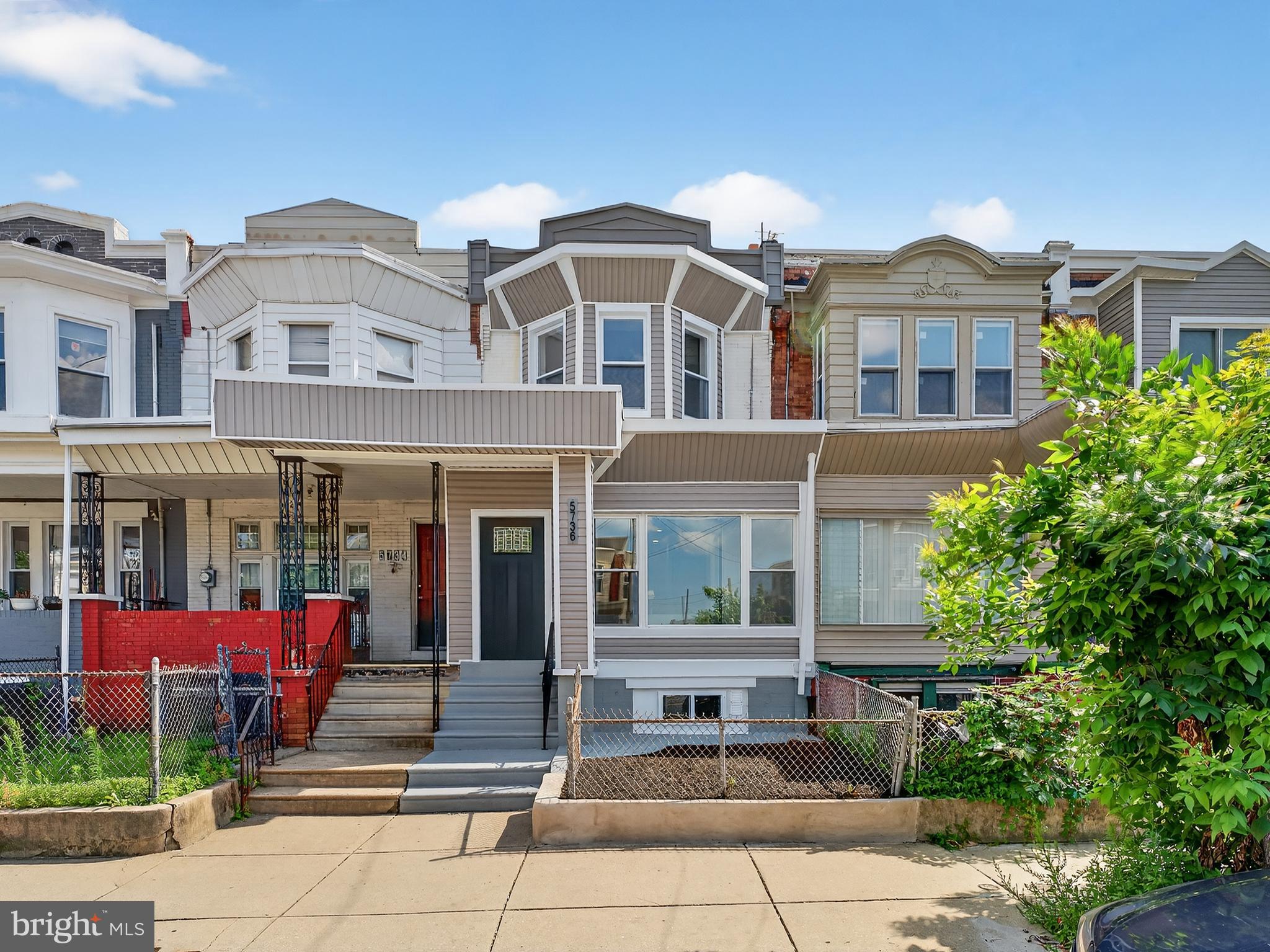 5736 Spruce Street Philadelphia, PA 19139 - Photo 31 of 32 front view of a building with a yard