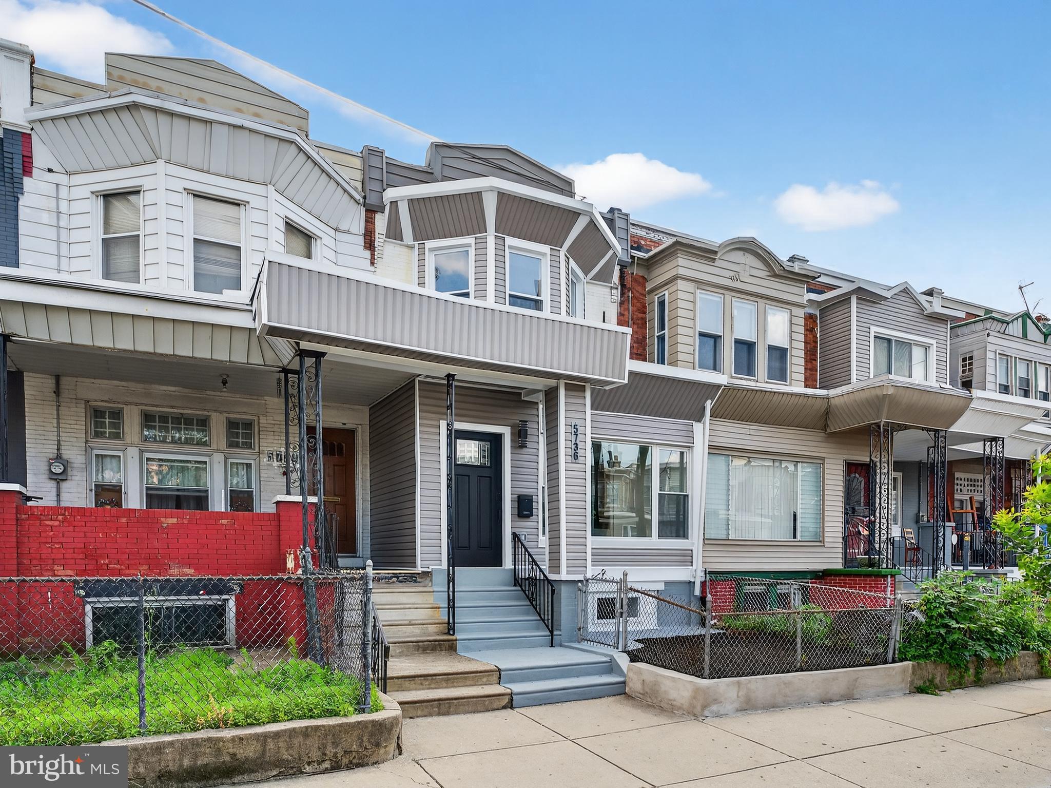 5736 Spruce Street Philadelphia, PA 19139 - Photo 32 of 32 front view of a brick building with a yard