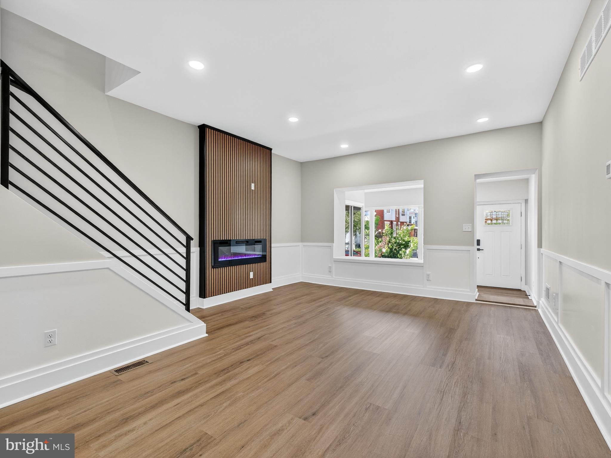 5736 Spruce Street Philadelphia, PA 19139 - Photo 9 of 32 wooden floor in an empty room with a window