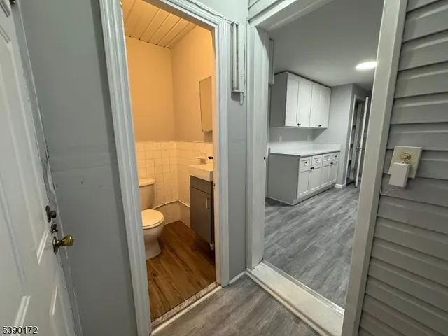 a view of a bathroom with a tub mirror and a floor to ceiling window