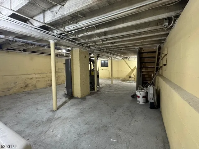 a view of empty room with wooden walls