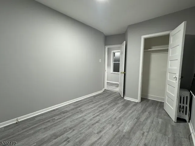 a view of a livingroom with wooden floor