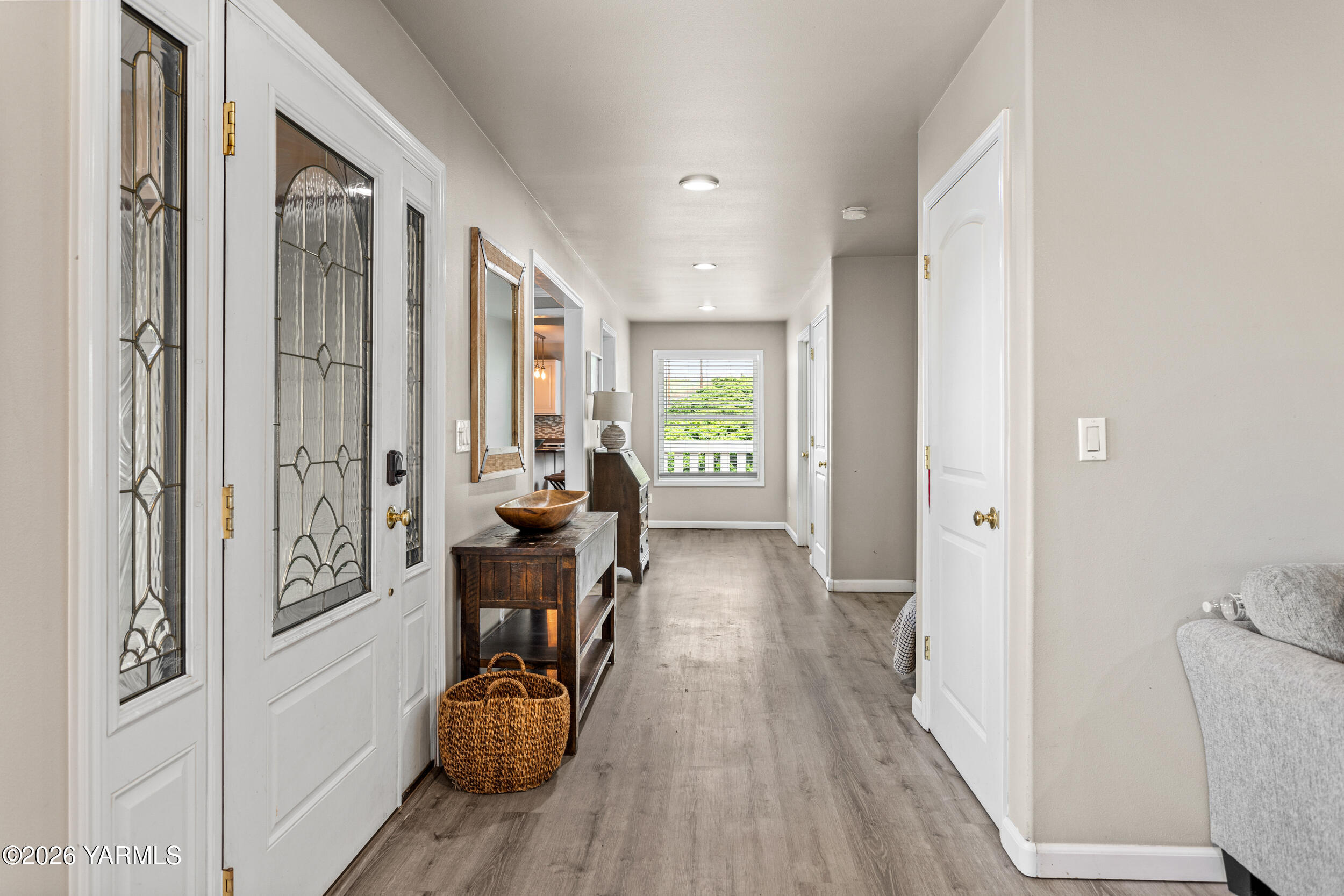 2121 Pleasant Hill Road Selah, WA 98942 - Photo 6 of 38 a view of a hallway with couch and wooden floor