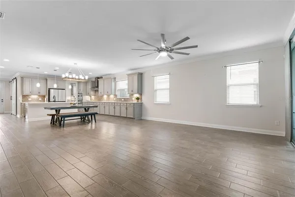 a view of workspace with windows cabinet and a ceiling fan