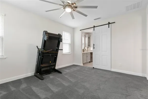 a kitchen with stainless steel appliances and cabinets