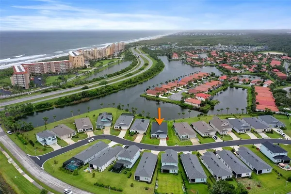 an aerial view of swimming pool patio and mountain view in back
