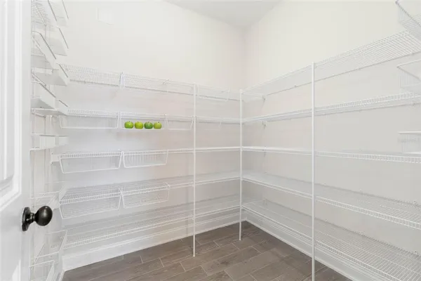 a room with a desk and a window