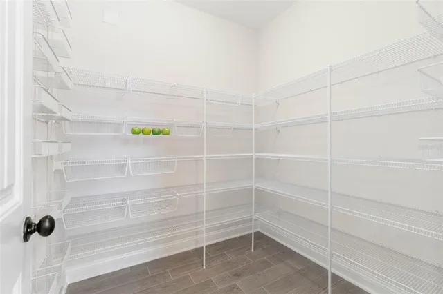 a room with a desk and a window