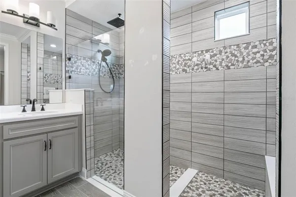 a bathroom with a sink and a mirror