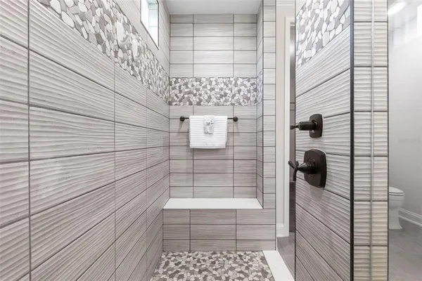 a view of a lake with houses in the back