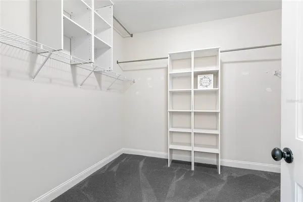 an aerial view of a house with a lake view