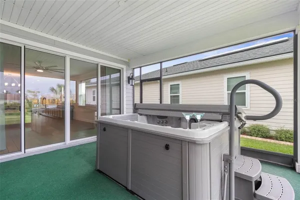 an aerial view of a house with yard swimming pool and outdoor seating