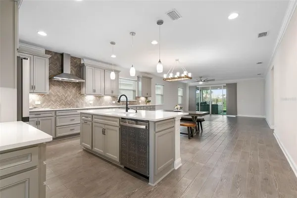 a kitchen with a table and chairs in it